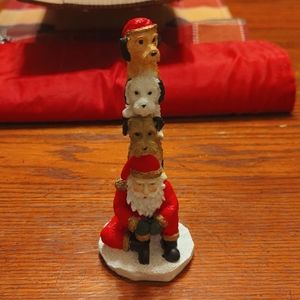 Figurines featuring Santa with 3 dogs